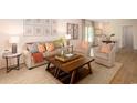 Comfortable living room featuring neutral colors, modern furniture, and a cozy rug at 362 Ladyfish Loop, Sunset Beach, NC 28468