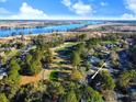 Aerial view of the property nestled on a golf course with a river in the distance, offering scenic views at 414 Dornoch Dr., Pawleys Island, SC 29585