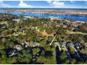 Lovely aerial perspective of the property amid lush trees, showcasing its serene setting and access to nearby amenities at 414 Dornoch Dr., Pawleys Island, SC 29585