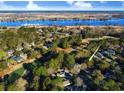 Beautiful aerial view of the property surrounded by lush greenery, near a river and golf course at 414 Dornoch Dr., Pawleys Island, SC 29585