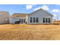 Expansive backyard with a well-maintained lawn, providing ample space for outdoor activities and relaxation at 7375 Sarteano Dr., Myrtle Beach, SC 29572