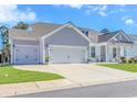 Spacious driveway leading to a two-car garage, surrounded by well-maintained landscaping at 746 Hickman Dr., Surfside Beach, SC 29575