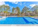 Relaxing pool with a view of the water and beautiful landscaping at 746 Hickman Dr., Surfside Beach, SC 29575