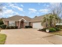 Beautiful red brick home with well-maintained landscaping, large driveway and attached two car garage at 951 Foxtail Dr., Longs, SC 29568