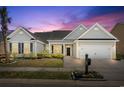Charming single-story home with a manicured lawn, black shutters, one-car garage, and inviting curb appeal at 1178 Shire Way, Myrtle Beach, SC 29577