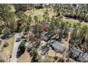 Aerial view of the property showcasing its location near a golf course and wooded area at 138 Wofford Rd., Conway, SC 29526