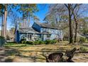 Spacious backyard featuring well-maintained landscaping and an inviting patio area with outdoor seating at 138 Wofford Rd., Conway, SC 29526