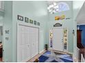 Bright foyer with high ceilings, tile flooring, and a view of the front door at 138 Wofford Rd., Conway, SC 29526