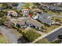 Aerial view of a luxury home with a pool and golf course views in a desirable community at 1549 Casita Ln., Myrtle Beach, SC 29579