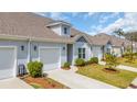 Beautiful townhome exteriors with well-manicured lawns and attached garages on a sunny day at 174 Sea Shell Dr. # 19, Murrells Inlet, SC 29576