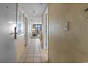 Hallway leading to the living room with tile flooring and views of the seating and ocean at 2301 S Ocean Blvd. # 1023, Myrtle Beach, SC 29577