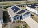 Drone shot of home with solar panels, manicured yard, and two car garage at 2848 Ophelia Way, Myrtle Beach, SC 29577