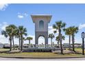 Community monument featuring palm trees and manicured landscaping at 2848 Ophelia Way, Myrtle Beach, SC 29577