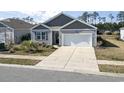 Attractive single-Gathering home featuring a two-car garage and concrete driveway at 2848 Ophelia Way, Myrtle Beach, SC 29577