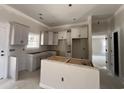 Modern kitchen with stylish white cabinets and an island, ready for your culinary adventures at 2925 Hughes Gasque Rd., Aynor, SC 29511