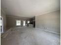 Spacious living room with large windows and neutral walls, providing a blank canvas for personalization at 2925 Hughes Gasque Rd., Aynor, SC 29511