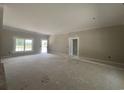 Bright living room with a view to the outside and an open doorway to another room at 2925 Hughes Gasque Rd., Aynor, SC 29511