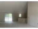Bright living room boasts sliding glass doors and ample natural light at 2929 Hughes Gasque Rd., Aynor, SC 29511
