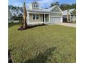 Charming one-story home with a manicured lawn and well-maintained landscaping at 382 Waties Dr., Murrells Inlet, SC 29576