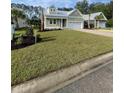 Charming one-story home with a manicured lawn and well-maintained landscaping at 382 Waties Dr., Murrells Inlet, SC 29576