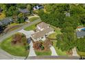 An aerial view of a well-maintained property, showcasing its extensive driveway and landscaping at 404 Club Dr., Myrtle Beach, SC 29572