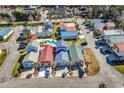 Aerial view of colorful homes with diverse metal roofs in a well-maintained community with a pool at 4350 Grande Harbour Blvd., Little River, SC 29566