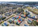 Aerial view of colorful homes in a well-maintained community near a river and pond at 4350 Grande Harbour Blvd., Little River, SC 29566