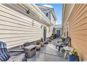 Inviting outdoor patio featuring comfortable seating, potted plants, and a tranquil atmosphere for relaxing at 4350 Grande Harbour Blvd., Little River, SC 29566