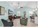 Inviting living room with high ceilings, a ceiling fan, and comfortable seating arrangements at 4350 Grande Harbour Blvd., Little River, SC 29566