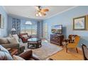 Inviting living room with a cozy seating area, large window, and stylish decor, perfect for relaxing or entertaining at 4503 W Harbour Ct. # S-12, Little River, SC 29566