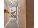 An interior hallway showing the living space, brown walls, and tan carpet at 4814 Innisbrook Ct. # 412, Myrtle Beach, SC 29579