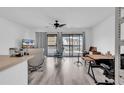 Bright living room with sliding doors and a ceiling fan for added comfort at 500 Fairway Village Dr. # 7-D, Myrtle Beach, SC 29588
