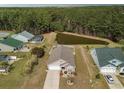 Aerial shot of home backing up to a large pond and wooded area at 511 Mattamushkeet Dr., Little River, SC 29566