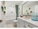 Well-lit bathroom featuring a shower-tub combo, white vanity, and contemporary decor at 512 9Th Ave. S, North Myrtle Beach, SC 29582