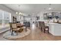 Spacious living area with a dining set and a view of the modern kitchen and comfortable lounge at 6037 Campanella St., Myrtle Beach, SC 29577