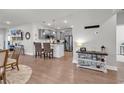 Open-concept living space flows into a modern kitchen with stainless steel appliances and stylish decor at 6037 Campanella St., Myrtle Beach, SC 29577