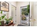 Bright foyer with tile flooring, an open doorway, and a view of the landscaped front yard at 611 Indigo Bunting Ln. # 42 E, Murrells Inlet, SC 29576
