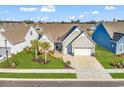 An aerial view shows a well-maintained home, lush green lawn, lovely landscaping, and a neighborhood setting at 7205 Spoleto Dr., Myrtle Beach, SC 29572