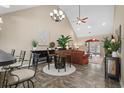 Spacious living room has a high ceiling, neutral paint, and a seamless connection to the dining area at 822 Foxtail Dr. # 822, Longs, SC 29568