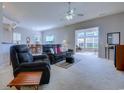 Spacious living room with comfortable seating and lots of natural light at 1017 Meadowlands Trail, Calabash, NC 28467