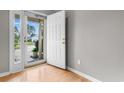 Bright foyer featuring a glass door and sidelight with wood flooring at 1202 Formby Ct., Myrtle Beach, SC 29588