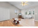 Spacious living room featuring light colored wood floors and sliding door leading to outside patio at 1202 Formby Ct., Myrtle Beach, SC 29588