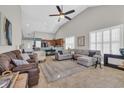 Spacious living room with vaulted ceiling, tile flooring, and view into kitchen at 133 Hartwell Dr., Little River, SC 29566