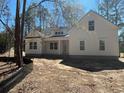 Bright single-story home with white siding, offering great curb appeal and a welcoming entrance at 19 Coventry Pl., Pawleys Island, SC 29585