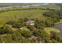 Expansive estate featuring a luxurious home, golf course, and waterfront access at 192 Berkshire Loop, Pawleys Island, SC 29585