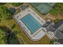 Community swimming pool and tennis courts, perfect for outdoor activities at 192 Berkshire Loop, Pawleys Island, SC 29585