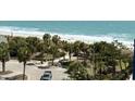 Breathtaking beach view framed by lush palms with turquoise waters and a pristine sandy shore at 2001 S Ocean Blvd. # 621, Myrtle Beach, SC 29577