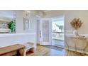 Bright entryway featuring hardwood floors, trim, and a view of the outdoor porch through the glass door at 209 30Th Ave. N, North Myrtle Beach, SC 29582