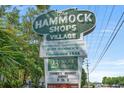 Sign for the Hammock Shops Village featuring 23 unique shops and a farmer's market on Sundays at 224 Ford Rd., Pawleys Island, SC 29585