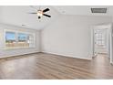 Spacious bedroom featuring carpet, ceiling fan and a large window for natural light at 235 Six Mile Creek Dr., Georgetown, SC 29440